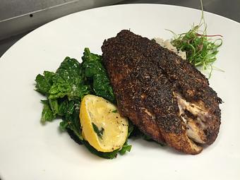 Product: Blackened Seared Gulf Coast Red Drum with red beans and rice, accompanied by sauteed ice root spinach and lemon. - Michael Anthony's at the Inn in Versailles, OH Restaurants/Food & Dining