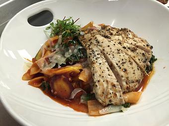 Product: Garganelli pasta with sauteed wild mushrooms, shallots, zucchini, yellow squash, heirloom carrots, fresh basil and kale in a pan-made tomato sauce then topped with Parmigiano Reggiano and grilled chicken. - Michael Anthony's at the Inn in Versailles, OH Restaurants/Food & Dining