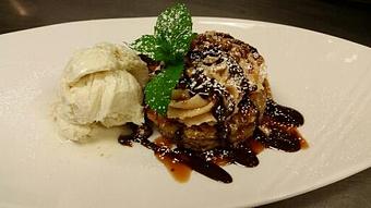 Product: Warm oatmeal pie topped with a peanut buttercream, chocolate ganache and toasted almonds, served with vanilla bean ice cream. - Michael Anthony's at the Inn in Versailles, OH Restaurants/Food & Dining