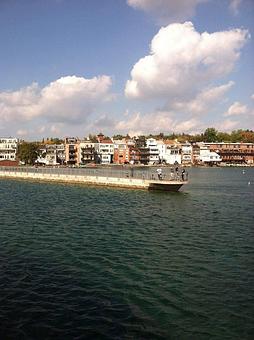 Product: The pier and backs of the storefronts that line Genesee Street in the village of Skaneateles.  Come experience the pristine, crystal clear water. - Mid-Lakes Navigation Company in Skaneateles, NY Business Services