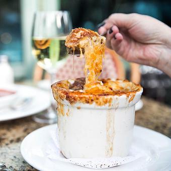 Product: Onion Soup Au Gratin, French classic baked with gruyère - Mon Ami Gabi in Oakbrook Center - Oak Brook, IL French Restaurants