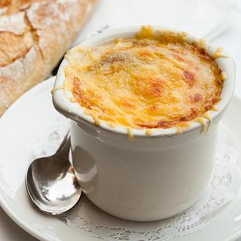 Product: Onion Soup Au Gratin ~ the French classic baked with gruyère - Mon Ami Gabi in Oakbrook Center - Oak Brook, IL French Restaurants
