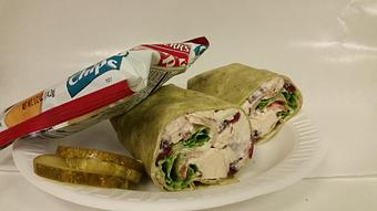 Product: Cranberry Chicken Salad on a spinach wrap with lettuce & tomato. - Monmouth Clubhouse Deli in Ocean, NJ Delicatessen Restaurants