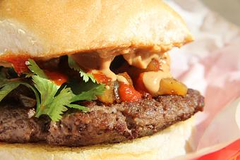 Product: Teriyaki glazed pineapple and jalapenos, crunchy peanut sauce, sriracha, and cilantro. - Moonie's Burger House- Cedar Park in Cedar Park, TX American Restaurants