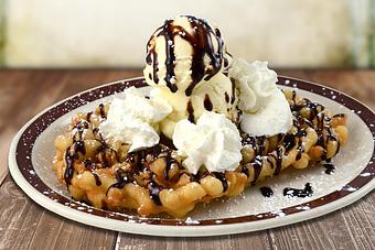Product: Loaded Funnel Cake - Moosejaw Pizza in The Waterpark Capital of the World in Wisconsin Dells! - Wisconsin Dells, WI American Restaurants Product: Loaded Funnel Cake - Moosejaw Pizza in The Waterpark Capital of the World in Wisconsin Dells! - Wisconsin Dells, WI American Restaurants