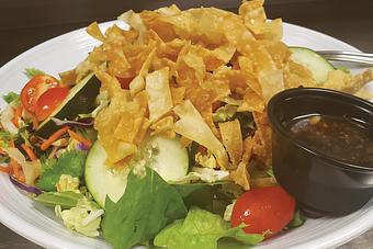 Product: With Asian Sesame dressing! - Moosejaw Pizza in The Waterpark Capital of the World in Wisconsin Dells! - Wisconsin Dells, WI American Restaurants Product: With Asian Sesame dressing! - Moosejaw Pizza in The Waterpark Capital of the World in Wisconsin Dells! - Wisconsin Dells, WI American Restaurants