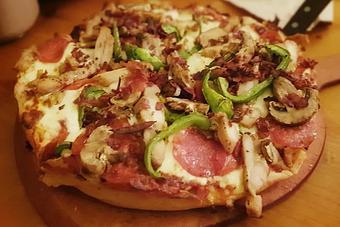Product: Add toppings to a 10" cheese pizza, choose thin or thick crust. - Moosejaw Pizza in The Waterpark Capital of the World in Wisconsin Dells! - Wisconsin Dells, WI American Restaurants Product: Add toppings to a 10" cheese pizza, choose thin or thick crust. - Moosejaw Pizza in The Waterpark Capital of the World in Wisconsin Dells! - Wisconsin Dells, WI American Restaurants