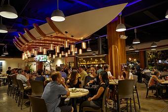 Product: Our dining area features our one of a kind boat bar. It's more beautiful in person. - Upstairs at Pier 38 in Honolulu, HI Seafood Restaurants