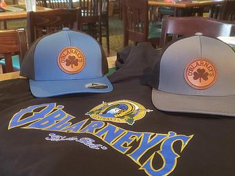 Product: Ask about O'Blarneys Gear - We have hats, t-shirts, tank tops, zip-up sweatshirts and more.  Disclaimer - Subject to availability - we do run out of things. - O'Blarney's Pub & Restaurant in Olympia, WA Irish Restaurants