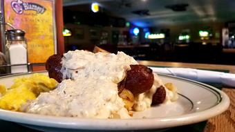 Product: Banger and Hash - Two Banger Sausages, Two Eggs, and Hashbrowns smothered in Country Gravy served with Toast. - O'Blarney's Pub & Restaurant in Olympia, WA Irish Restaurants