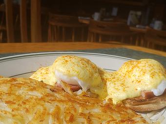 Product: Eggs Benedict - Toasted English Muffin topped with two poached Eggs, Grilled Ham, and Hollandaise served with Hashbrowns. - O'Blarney's Pub & Restaurant in Olympia, WA Irish Restaurants
