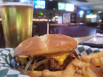 Product: The Fair Burger - A 1/3 lb. Patty with American cheese and O'Blarney's special sauce loaded with grilled onions. - O'Blarney's Pub & Restaurant in Olympia, WA Irish Restaurants