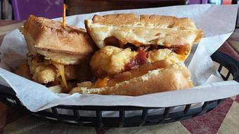 Product: Chicken & Waffle Sliders – Toasted Waffles, Fried Chicken, Melted Cheddar and Bacon Crumbles with Honey Mustard Sauce. - O'Henry's Food & Spirits in Metairie, LA American Restaurants