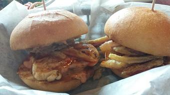 Product: Sriracha Chicken Sliders -  Grilled chicken basted in Sriracha Sauce on a slider bun with our Zydeco Sauce,  and crispy fried red onion straws. - O'Henry's Food & Spirits in New Orleans, LA Barbecue Restaurants