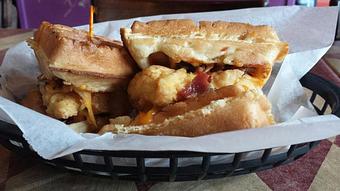 Product: Chicken & Waffle Sliders – Toasted Waffles, Fried Chicken, Melted Cheddar and Bacon Crumbles with Honey Mustard Sauce. - O'Henry's Food & Spirits in New Orleans, LA Barbecue Restaurants