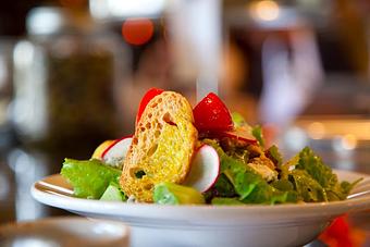 Product: Seasonally inspired menu with daily specials. Pictured: Garden Lettuces Salad. - Onespeed in Sacramento, CA Pizza Restaurant