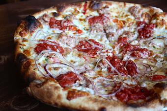 Product: Seasonally inspired menu with daily specials. Pictured: House Made Italian Sausage Pizza. - Onespeed in Sacramento, CA Pizza Restaurant