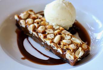 Product: Seasonally inspired menu with daily specials. Pictured: Caramel Brownie Bar. - Onespeed in Sacramento, CA Pizza Restaurant