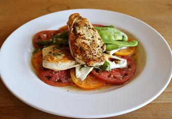 Product: Seasonally inspired menu with daily specials. Pictured: Grilled Chicken with Heirloom Tomatoes & Fresh Mozzarella. - Onespeed in Sacramento, CA Pizza Restaurant