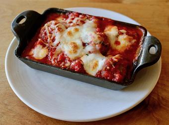 Product: Seasonally inspired menu with daily specials. Pictured: Polenta & Meatballs with Tomato Sauce, Fresh Mozzarella, Fontina - Onespeed in Sacramento, CA Pizza Restaurant