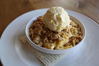 Product: Seasonally inspired menu with daily specials. Pictured: Apple Hill Apple Crisp with Vanilla Ice Cream - Onespeed in Sacramento, CA Pizza Restaurant