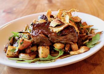 Product: Seasonally inspired menu with daily specials. Pictured: Balsamic Braised Short Ribs with Winter Vegetable Hash, Fried Artichokes, Black Pepper, Natural Jus - Onespeed in Sacramento, CA Pizza Restaurant