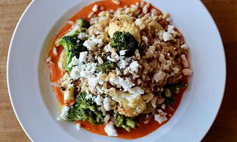 Product: Seasonally inspired menu with daily specials. Pictured: Farro Salad with Golden Raisins, Romesco, Roasted Cauliflower & Broccoli, Feta - Onespeed in Sacramento, CA Pizza Restaurant