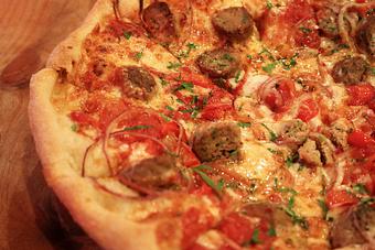 Product: Seasonally inspired menu with daily specials. Pictured: House Made Meatball Pizza with Red Onions, Sweet Peppers, Smoked Mozzarella, Crushed Tomatoes - Onespeed in Sacramento, CA Pizza Restaurant