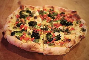 Product: Seasonally inspired menu with daily specials. Pictured: Vegan Pie with Roasted Broccoli, Leeks, Cauliflower Puree, Castelvetrano Olives, Almond-Piquillo Relish - Onespeed in Sacramento, CA Pizza Restaurant