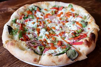 Product: Garden Pizza with Spinach, Peppers, Green Olives, Red Onions, Ricotta, Fontina, Tomato Vinaigrette - Onespeed in Sacramento, CA Pizza Restaurant