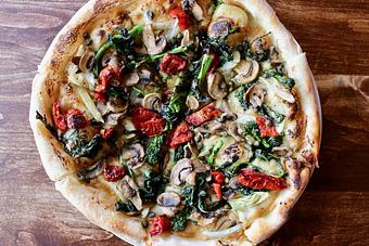 Product: Vegan Pie with Roasted Garlic Spread, Preserved Tomatoes, Mushrooms, Roasted Fennel, Broccoli Rabe, Capers - Onespeed in Sacramento, CA Pizza Restaurant