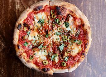 Product: Napoletana Pizza with Eggplant, Green Olives, Capers, Mozzarella, Tomato Sauce, Anchovy, Basil, Garlic Oil - Onespeed in Sacramento, CA Pizza Restaurant