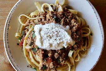 Product: House Made Fettuccine ala Bolognese with Parmesan-Pepper Cream & Herbs - Onespeed in Sacramento, CA Pizza Restaurant