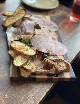 Product: Antipasto Plate: Selection of Cured Meats, Chicken Liver Mousse, Olives, Marinated Vegetables, Marinated Feta, Crostini. Photo Shared by: @flavortamers - Onespeed in Sacramento, CA Pizza Restaurant