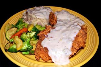Product: Chicken Fried Chicken w/ Garlic Mashed Potatoes and Grilled Veggies - Opal Divine’s Austin Grill in Travis Heights/ South Austin - Austin, TX American Restaurants