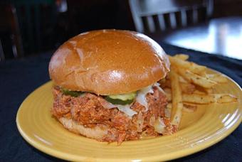 Product: Pulled Pork Sandwich & Fries - Opal Divine’s Austin Grill in Travis Heights/ South Austin - Austin, TX American Restaurants