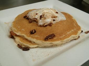 Product: fresh carrot infused pancakes, cheese cake whipped cream, vanilla spice coated pecans, powdered sugar - Orange in Roscoe Village - Chicago, IL American Restaurants