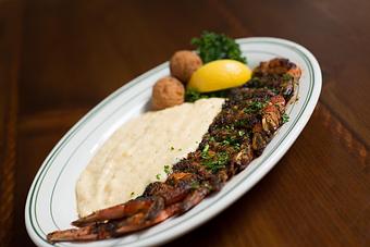 Product: Josh's Blackened Shrimp and Grits - Original Oyster House Boardwalk in Gulf Shores, AL Seafood Restaurants