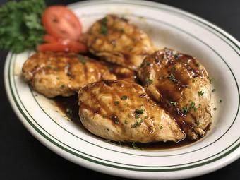 Product: Bourbon Grilled Chicken Breasts - Original Oyster House Boardwalk in Gulf Shores, AL Seafood Restaurants