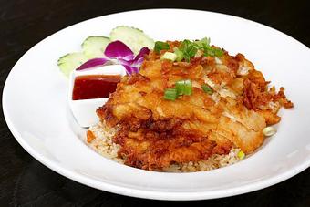 Product: served over egg fried rice with sweet chilli sauce - Osha Thai Noodle Cafe in Tenderloin - San Francisco, CA Thai Restaurants Product: served over egg fried rice with sweet chilli sauce - Osha Thai Noodle Cafe in Tenderloin - San Francisco, CA Thai Restaurants