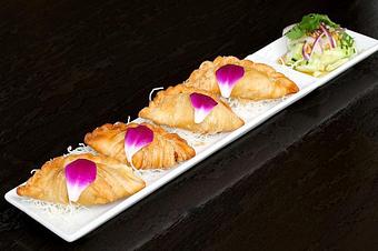 Product: Fried stuffed potato, curry, and onion served with fresh cucumber salad. - Osha Thai Noodle Cafe in Tenderloin - San Francisco, CA Thai Restaurants Product: Fried stuffed potato, curry, and onion served with fresh cucumber salad. - Osha Thai Noodle Cafe in Tenderloin - San Francisco, CA Thai Restaurants