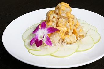 Product: Crispy calamari served with green apple & Sriracha cream sauce. - Osha Thai Noodle Cafe in Tenderloin - San Francisco, CA Thai Restaurants Product: Crispy calamari served with green apple & Sriracha cream sauce. - Osha Thai Noodle Cafe in Tenderloin - San Francisco, CA Thai Restaurants