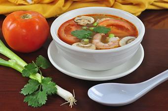 Product: Hot and sour soup broth with galangal, lemon grass, kaffir lime leaves, mushrooms, and tomatoes; garnished with green onions and cilantro - Pacific Thai Santa Cruz in Downtown Santa Cruz - Santa Cruz, CA Thai Restaurants