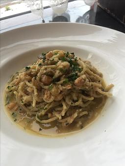 Product: Grandma's favorite winter recipe featuring a rich sauce of slow cooked sweet onions, sardines, garlic, chili flakes, golden raisins and parsley tossed with our house-made spaghetti. - Paesano Restaurant & Wine Bar in Ann Arbor, MI Italian Restaurants