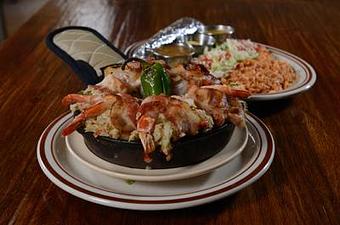 Product: Plump shrimp stuffed with imitation crab and whitefish wrapped in bacon and topped with a blend of green chiles and Monterrey jack cheese. Served with arroz, three flour tortillas, sides of red or green chile, and chile con queso. - Papa Felipe's in Albuquerque, NM Mexican Restaurants