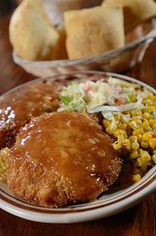Product: Battered and deep fried, lightly spiced whitefish and imitation crab. Cakes served over rice pilaf and topped with creamy mayo/honey/chipotle sauce. Comes with two sides, lemon/tomato garnish and lemon wedges. - Papa Felipe's in Albuquerque, NM Mexican Restaurants