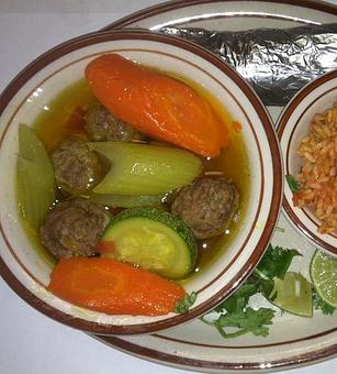 Product: Savory broth with seasoned meatballs, rice, carrots, squash, onions, celery and tomatoes in a large 16 oz. bowl. Served with a side of spanish rice, 3 small flour tortillas, lime wedges and chopped cilantro. - Papa Felipe's in Albuquerque, NM Mexican Restaurants