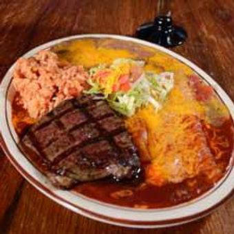 Product: A succulent six ounce choice top sirloin steak accompanied by two cheese enchiladas, choice of red or green chile and two sides with regular garnish. For the heartier appetite, upgrade to a 10 oz. sirloin for just $3 more. - Papa Felipe's in Albuquerque, NM Mexican Restaurants