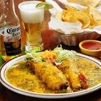 Product: Prepared in the traditional way with a large, full green chile pod, filled with cheese and fried in egg batter. covered with your choice of chile and garnish and served with two sides. - Papa Felipe's in Albuquerque, NM Mexican Restaurants