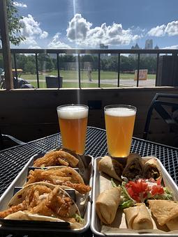 Product: Take in the views of the Midtown Skyline in Piedmont Park while you enjoy a Taco Tuesday with our Big Bang Shrimp Tacos and Southwest Eggrolls. Pair them with your favorite beer, sangria, margarita, or favorite cocktail. - Park Tavern in heart of Midtown - Atlanta, GA American Restaurants